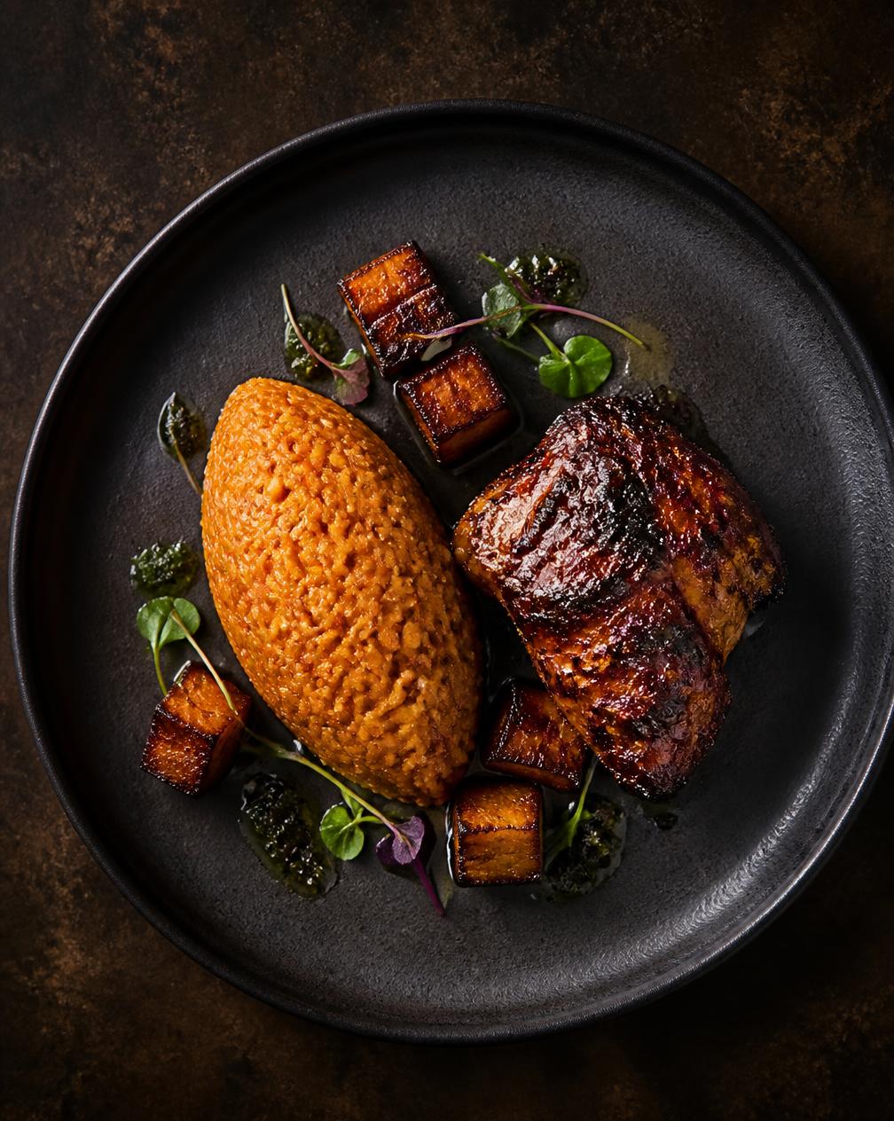 Party Jollof — Party-style Nigerian jollof rice cooked over wood fire, char-grilled chicken and caramelised plantain.