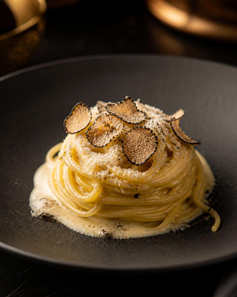 Truffle Pasta — Handmade tagliolini, parmesan cream and shaved black truffle.