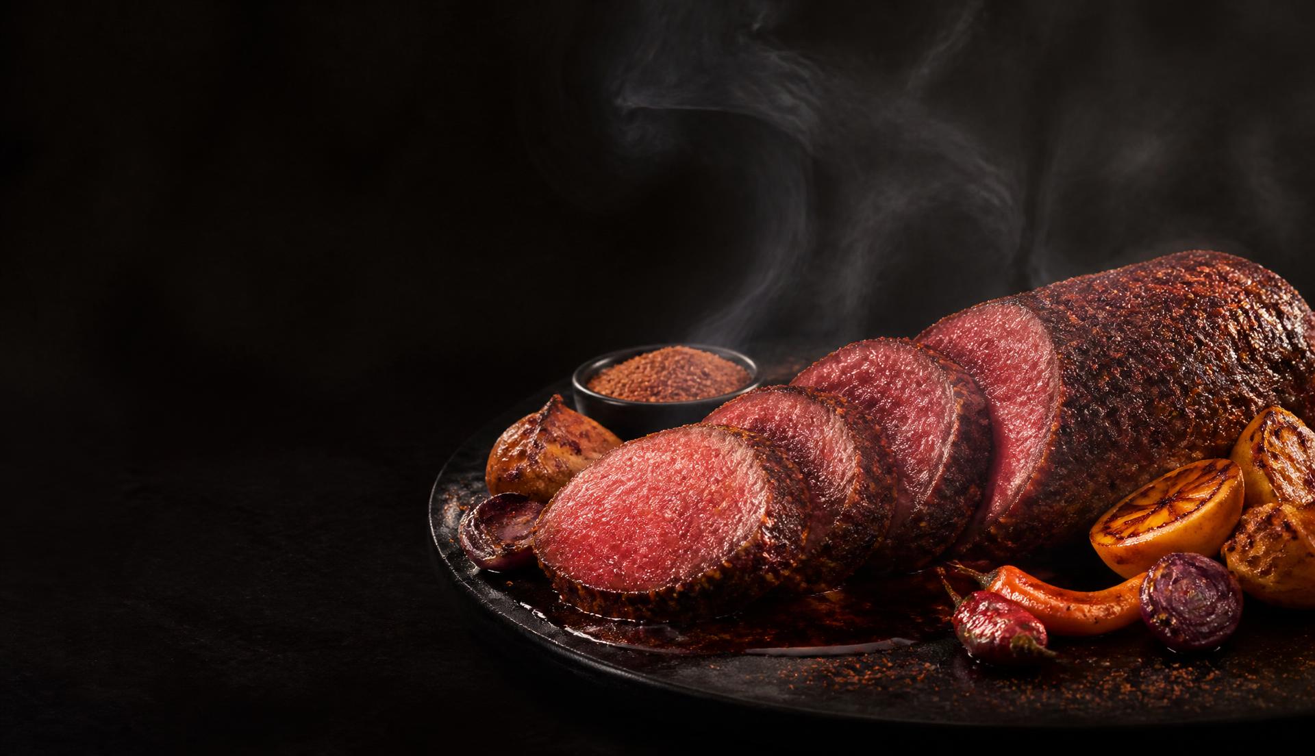 Smoked suya beef tenderloin, sliced and crusted in yaji spice